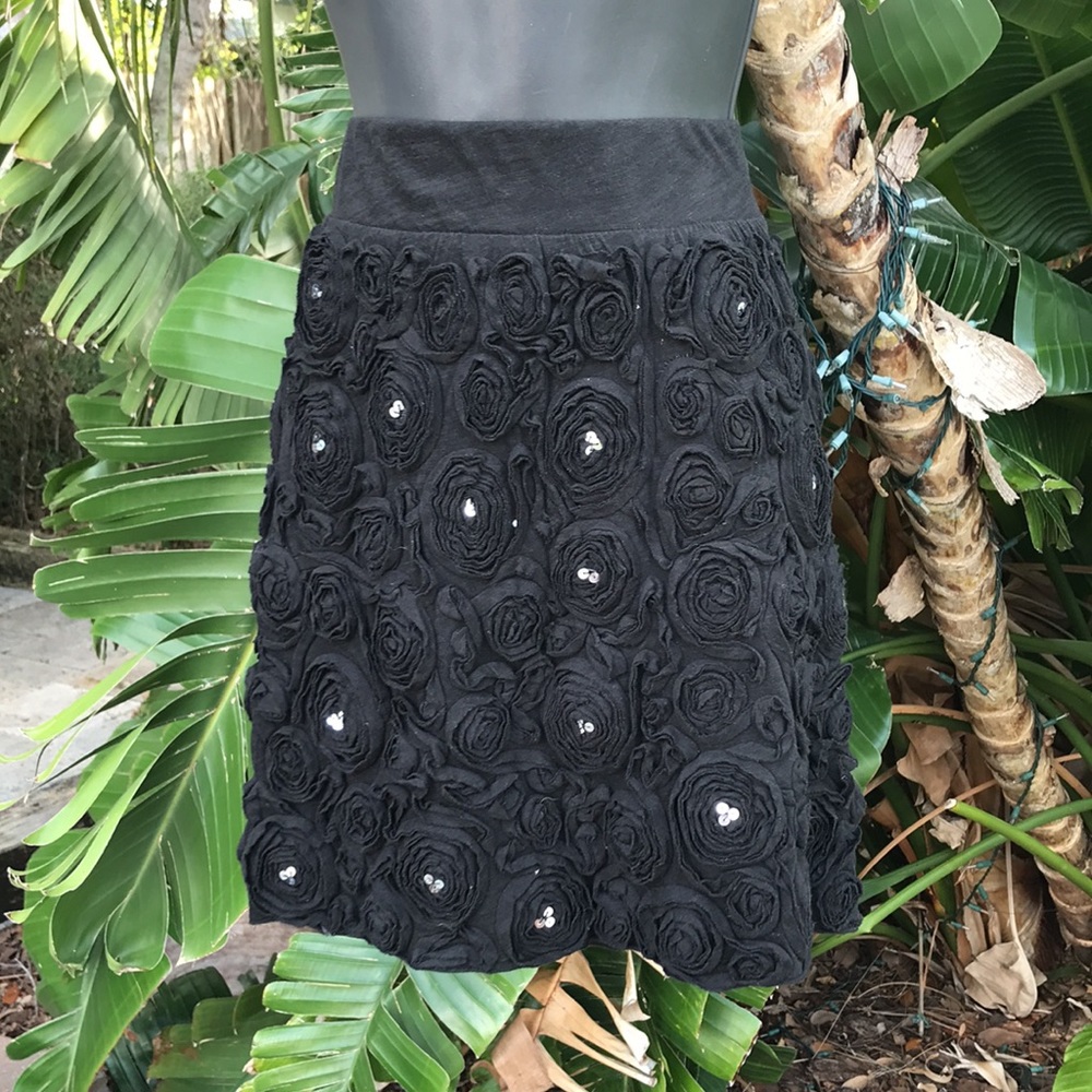 - Rosette-skirt floral with sequins